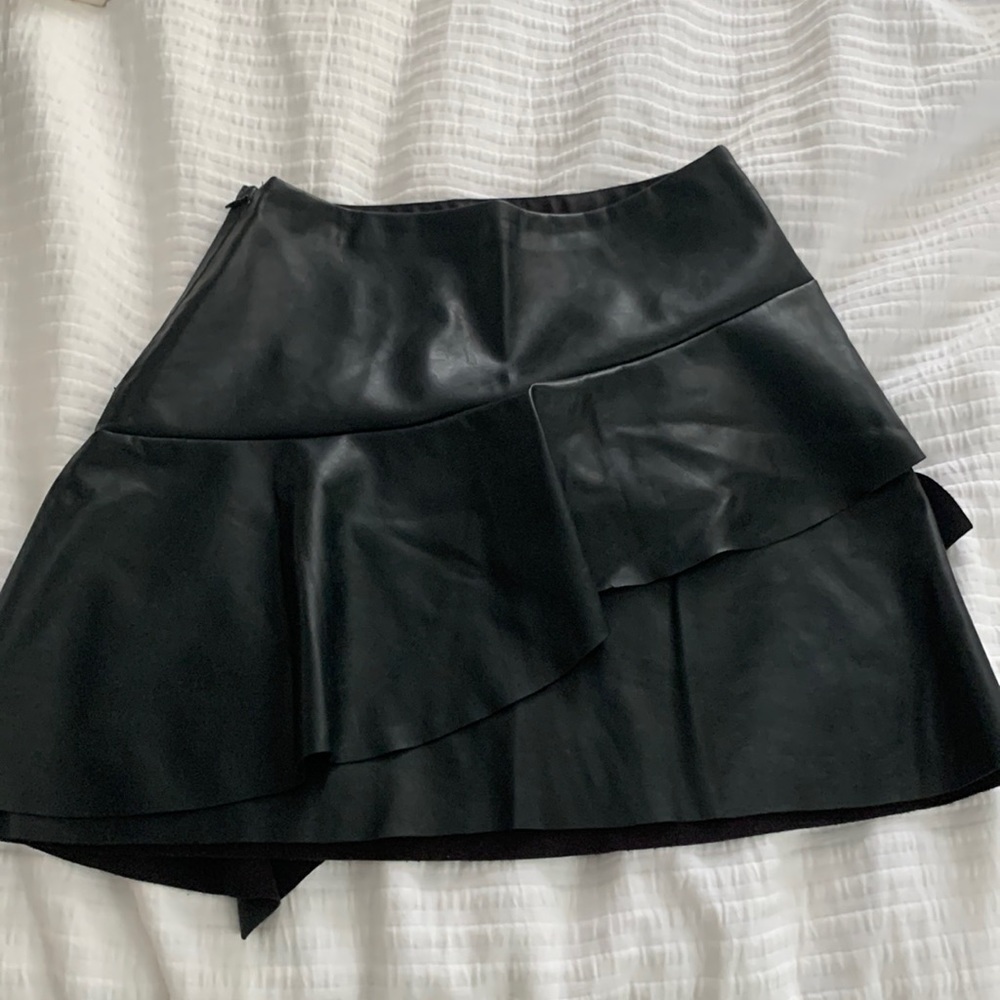 Black leather ruffle skirt. Size small. From vestique. Brand new with tags.
